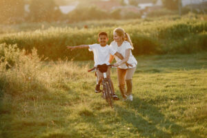 Fostering - Lady and boy on bike